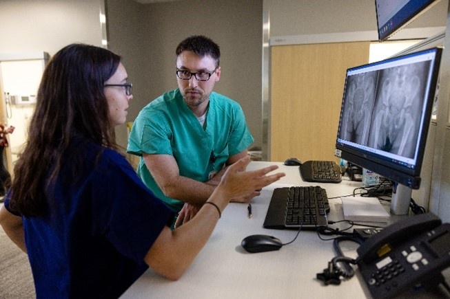 Orthopedic Surgery Residents and Faculty member Heather Kowalski, MD